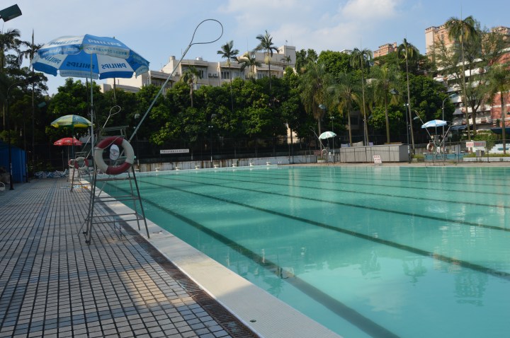 Chinese water torture: the pool I haven't been allowed to use, with my building in the background.